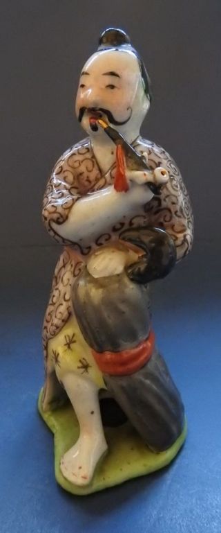 Chinese Porcelain Figure Of A Man Smoking A Pipe - 19th Century