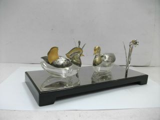 Seasoning case of the Sterling Silver mandarin duck.  and Sterling Silver flower. 2