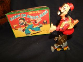 Vintage Tps Clown On Roller Skates Tin Litho Wind Up Toy With Box.