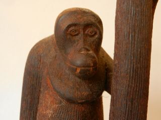 Antique Oriental Folk Art Carved Wood Depiction Of Sitting Ape Holding A Ball.