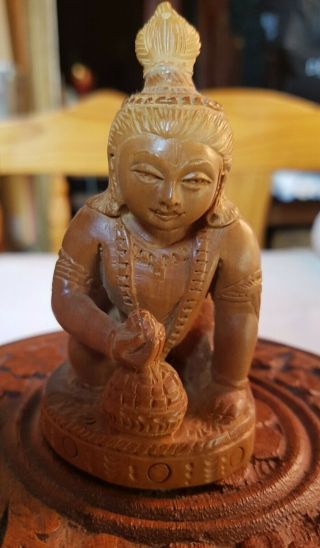 Carved Sandal Wood Statue Of Hindu God Baby Krishna With Honey Pot.