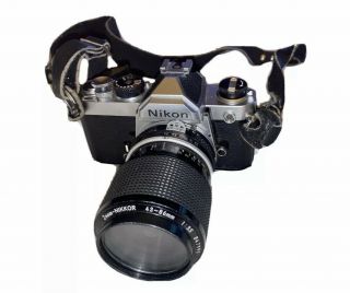Vintage Nikon Fm 35mm Film Slr Camera With Zoom Lens And Strap.