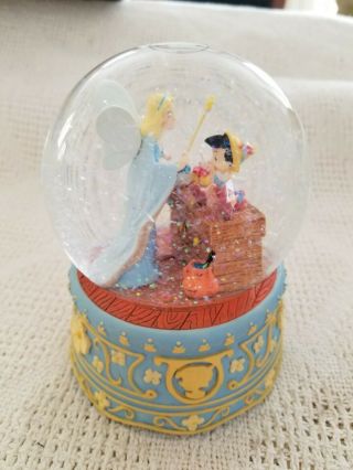 Disney Enesco Pinocchio Blue Fairy Musical Snowglobe Plays Toy Land