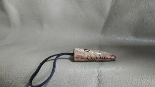 trinket carved from the elk horn (netsuke) 2