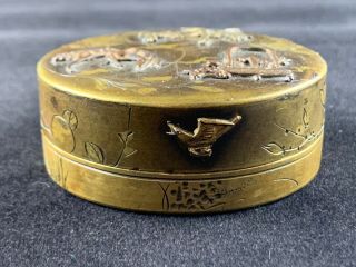 A Japanese 19th C.  bronze circular box and cover with mixed metal 3
