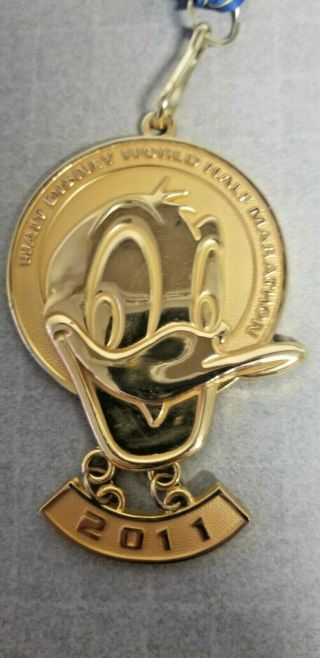 Authentic 2011 Disney Donald Duck Half Marathon Medal And Band