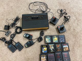 Vintage Atari Cx - 2600a Woodgrain 4 Switch Console W/ Paddles,  Joysticks,  Keyboard