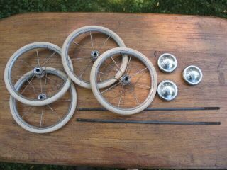 4 Vintage 7.  25 " Rubber Buggy Wheels With 2 Axles And 3 Welsh Hub Caps