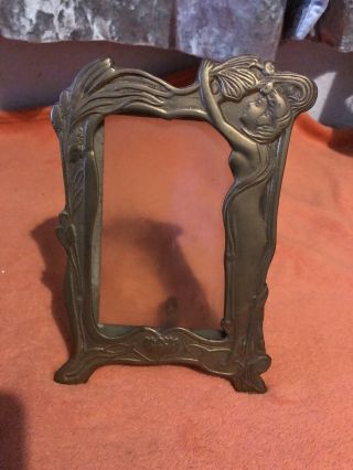 A Art Nouveau Brass Photograph Frame With Maiden,  Lily,  Floral