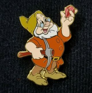 Disney Pin 8589 Snow White And The Seven Dwarfs Doc Looking At A Red Jewel Axe