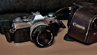 Canon Ae - 1 Slr Film Camera - Black With Vintage Brown Leather Case.