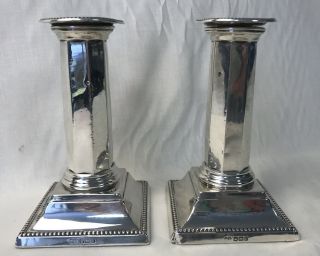 A 20th Century Sheffield Sterling Silver Filled Column Candlesticks