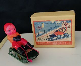 Vintage 1940s Occupied Japan Celluloid Boy On Tin Sledge Wind Up Toy