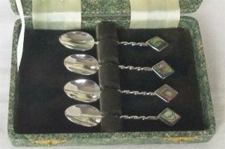 A FINE CASE SET OF SIX STERLING SILVER & ABALONE SHELL DEMI TASSE COFFEE SPOONS. 2