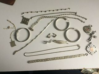 A Large Selection Of Silver Jewellery,  Bangle,  Brooch Chains,  Earrings