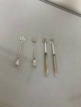 TWO PAIRS OF SOLID SILVER AND MOTHER OF PEARL PICKLE FORKS 2