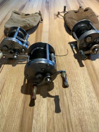 Bundle Of 3 Vintage Fishing Reels With Suede Bags And Spares