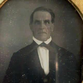 Sixth Plate Daguerreotype Of Older Man In Bow Tie With Grimace Oval Mat