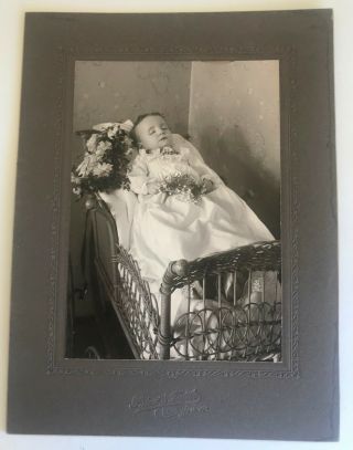 Antique Post Mortem Photograph Of Baby With Flowers Wicker Cradle Angelic Face
