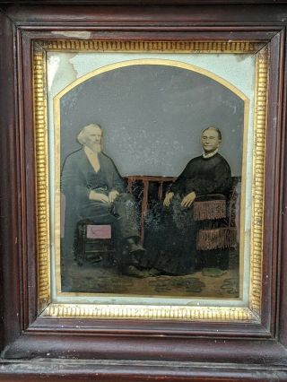 Tinted Full Plate Daguerreotype Of Older Couple Sitting In Chairs