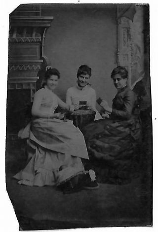 Tintype Showing Group Of Three Women Playing Cards At A Table In Studio Setting