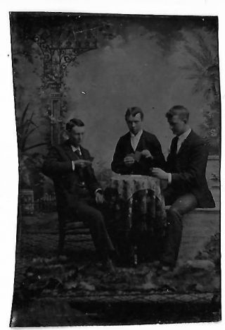 Tintype Showing Group Of Three Men Playing Cards At A Table In A Studio Setting