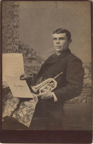 Cabinet Card Of A Musician With His Cornet And Sheet Music