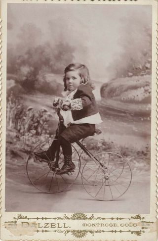 Cabinet Card Of A Beautifully Dressed Little Boy Riding A Tricycle Backdrop