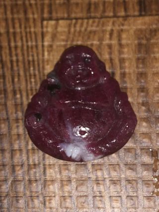 19.  87 Carat Carved Ruby Seated Buddha Prayer Stone Amulet