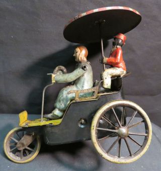 Vintage Lehmann German Tin - Litho Wind - Up Century Cycle Toy W/parasol,