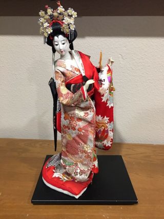 Japanese 20” Geisha Doll With Samurai Helmet In Silk Kimono With Wooden Base