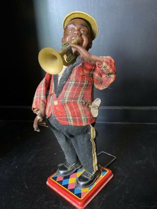 Nomura Tin Wind Up Louis Armstrong Trumpet Player Toy