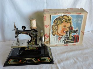 Casige Vintage German Child’s Sewing Machine And Instructions