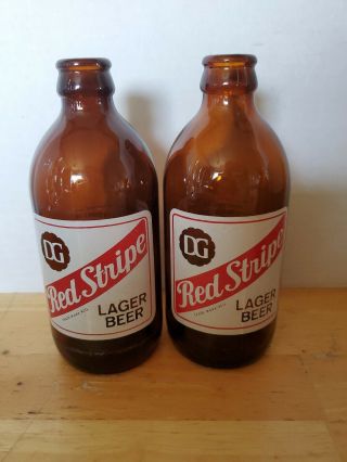 2) Vintage Dg Red Stripe Lager Beer Stubby 12oz Bottle Jamaica W.  I.  Canada Emboss