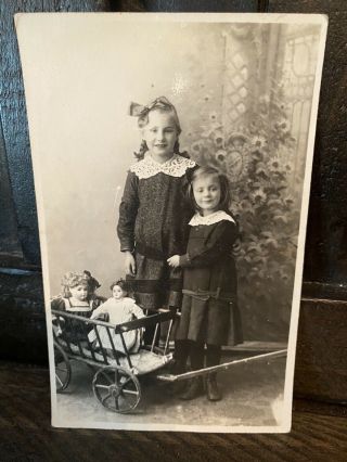 Antique Rppc Photo Of Sisters Girls With Fancy German Bisque Dolls Wagon