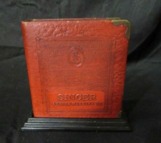 Vintage Singer Sewing Machine Co.  Metal Book Still Bank With Base And Key