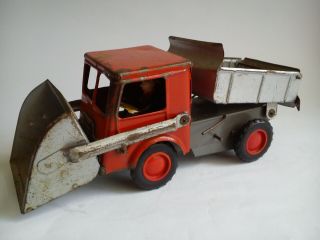 Very Rare Tin Toy Made In Poland Is A Dump Truck With A Paddle.