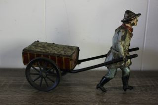 Antique Germany Wind Up Hand Painted Tin Toy Issmayer Man Pulling Cart