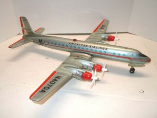 1958 Yonezawa Japan Big Tin Battery Op American Airlines Dc7 Airplane.  Nr