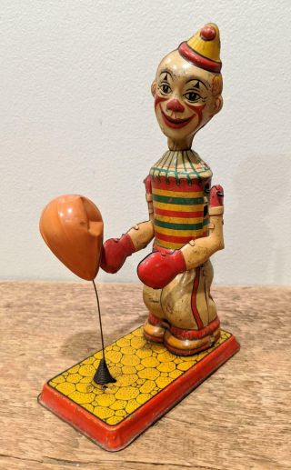 J.  Chein Clown Floor Puncher Tin Litho Windup Toy