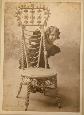 Victorian Cabinet Card Mischievous Child Li’l Girl Behind Rattan Chair