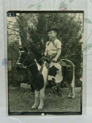 Little Boy Riding A Pony And All Dressed Up In Chaps & Hat Cowboy Jim