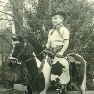 LITTLE BOY RIDING A PONY AND ALL DRESSED UP IN CHAPS & HAT COWBOY JIM 2