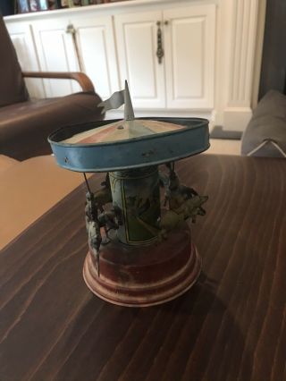 Antique German Wind - Up Tin Carousel W/4 Riders & Operator - Spins & Plays Music