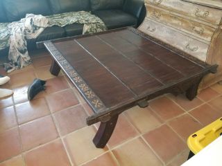 African Hand Carved Table With Leather And Metal Accents