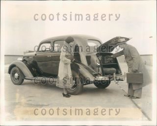 1934 Man Loads Luggage In Trunk Of Vintage 1935 Plymouth Sedan Auto Press Photo