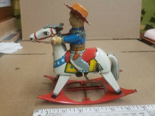 Vintage tin toy wind up cow boy on horse great. 2