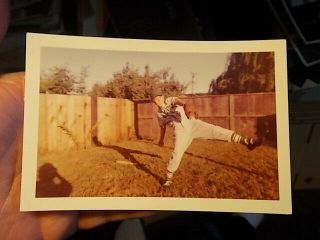 Vint Color Snapshot Photo,  Teenage Boy Practises Baseball Pitching Form In Yard