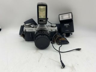 Vintage Canon Ae - 1 Camera With 50 Mm Lens And Flashes