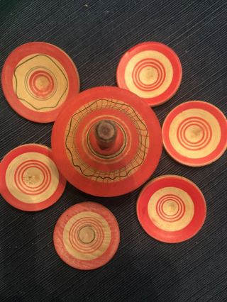 Wooden Spinning Top That Releases 6 Colorful Wooden Disks When Spun